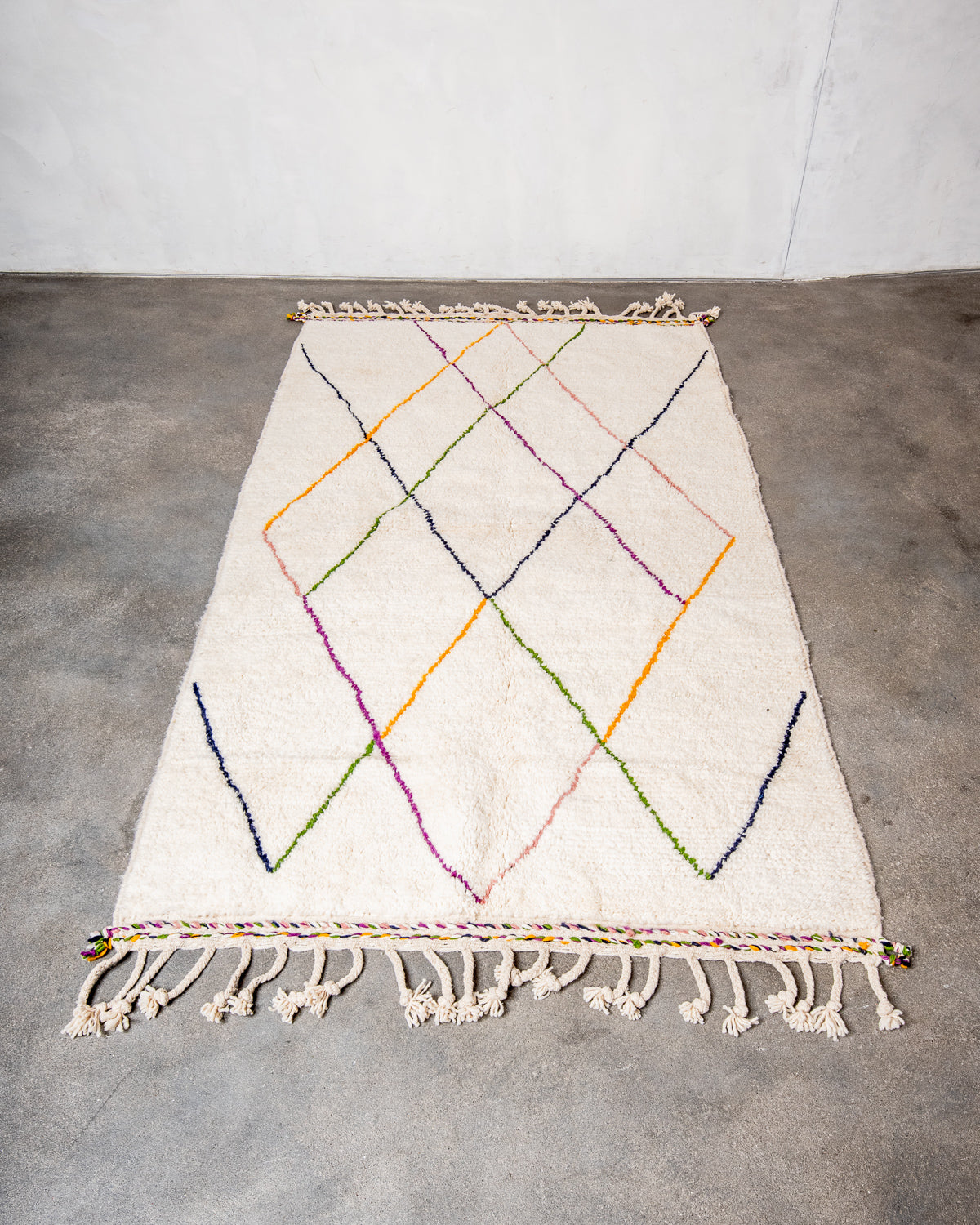 Modern, designer, handcrafted Berber rug from Morocco. Beniourain carpet with beautiful colours and patterns and fluffy wool texture.